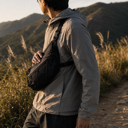 Front-chest three-point carry on a mountain trail